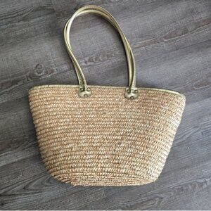 White stag woven straw tote bag with gold handles. In excellent condition.